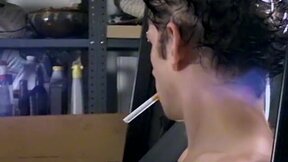 Attractive Ian Madrox is blowing smoke and starts stretching his cock in his smo
