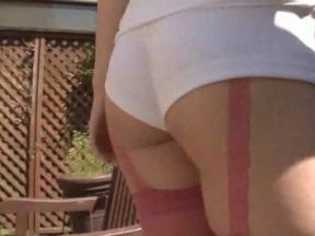 Japanese girl teases in pink stockings