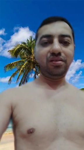 Naked boy playing with his big black cock on the virtual beach.