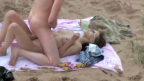 ”Couple masturbates on a cold beach”