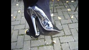 Walking in black patent leather high heels