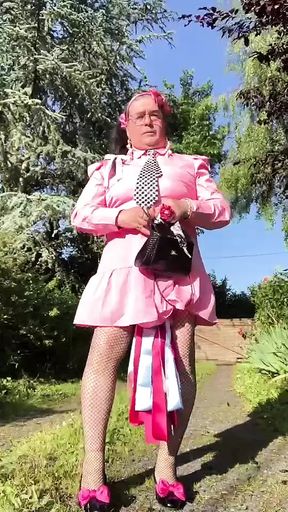 In an outfit with a little pink button dress for an evening.
