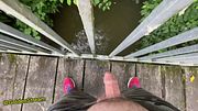 Teen Boy pisses off the public bridge