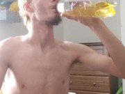 Tall fit skinny teen pisses inside a bottle and drinks it