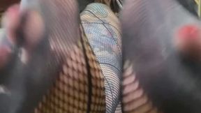 Black fishnets and wide toe spreads
