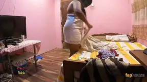 Desi Indian housewife gives a steamy blowjob in a compromising position.
