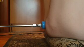 Naked person engaging in sexual activity with a fucking machine