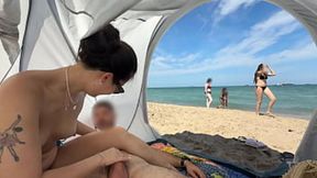 My Asian gf jerks me off while sitting in a public beach and I cum in her mouth