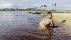 naked and jerking off inside a lagoon