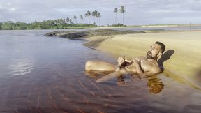 naked and jerking off inside a lagoon