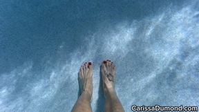 Carissa underwater in the hibiscus bikini with pedicured toes and wrinkled soles