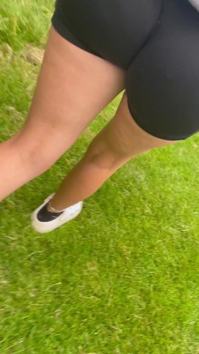 Amateur girl caught on candid camera showing off her juicy ass while playing wit
