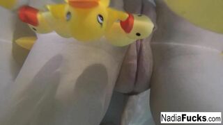 Nadia takes a bath with some rubber duckies