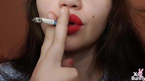 Big red lips smoking close up