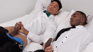 Latino hunk and a tall black fellow riding and sucking