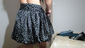 Trying on skirts by a lady without panties and in a bra with open nipples