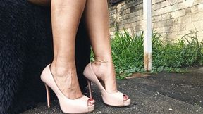 Stiletto heels dangle from feet with a pronounced high arch (3)